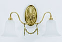 AN EDWARDIAN BRASS TWO-BRANCH WALL SCONCE, IN GEORGE III STYLE